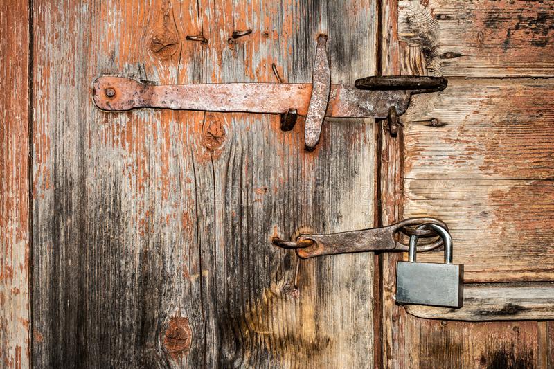 element-old-wooden-door-metal-handle-padlock-close-up-abstract-background-146502654~0.jpeg