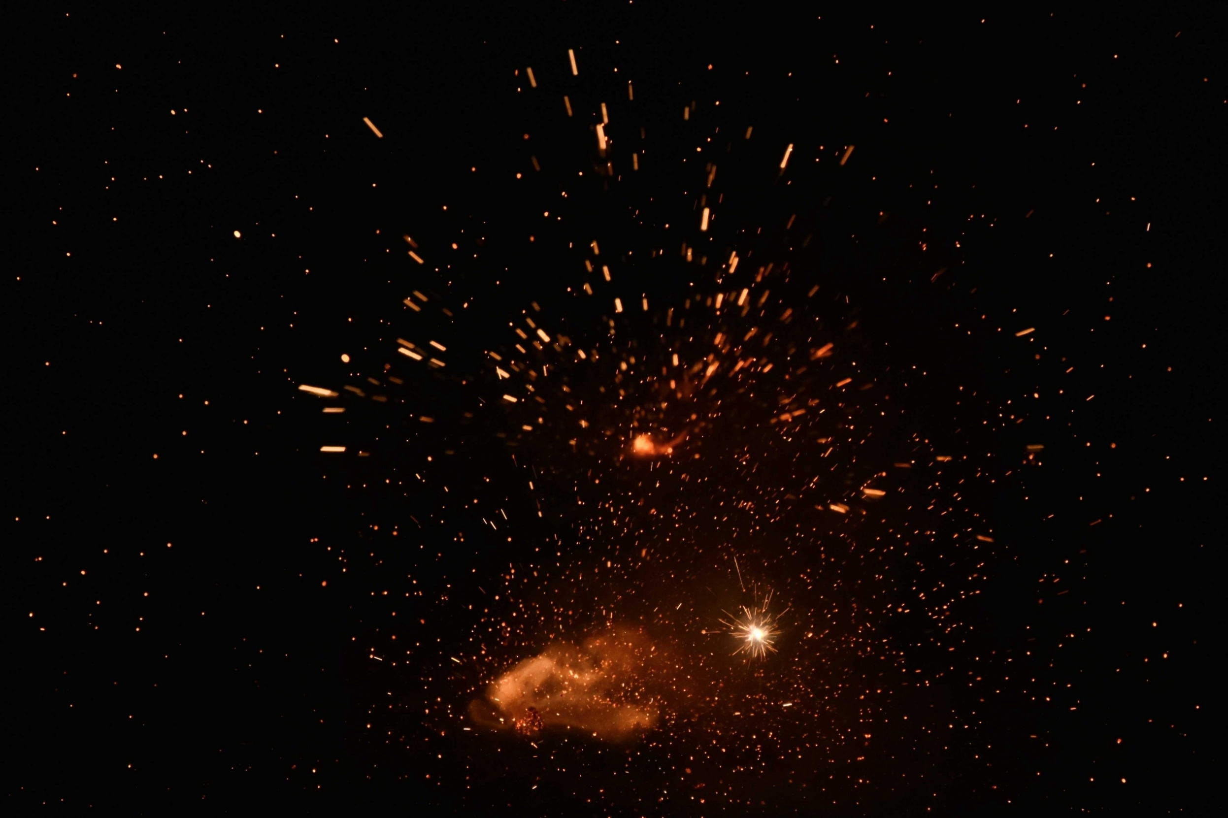 burning-sparks-flying-beautiful-flames-fiery-orange-glowing-flying-away-particles-on-black-background_t20_jRWexk.jpeg