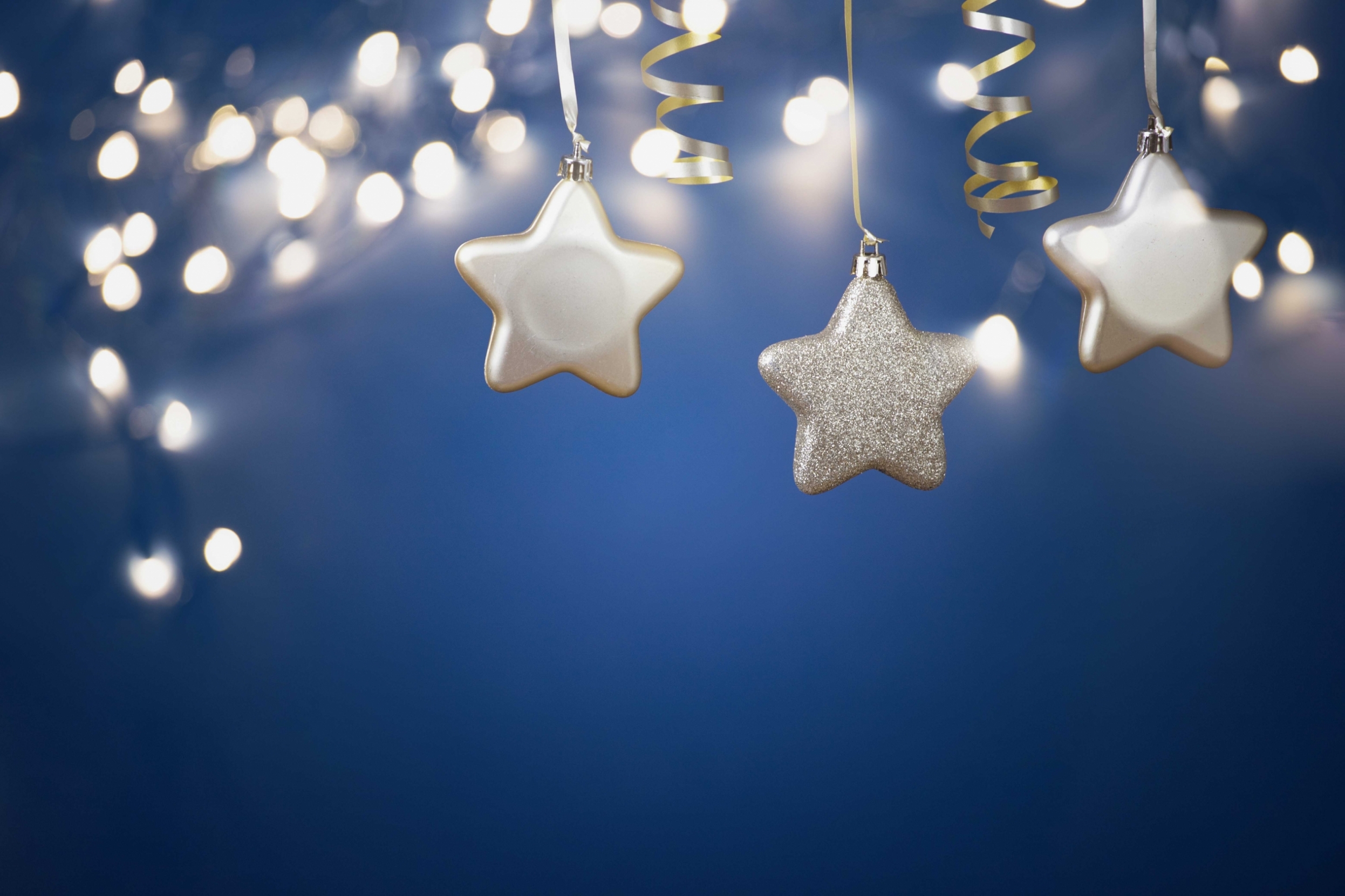 christmas-golden-star-ornaments-in-holiday-night-2021-08-29-21-02-26-utc.jpg