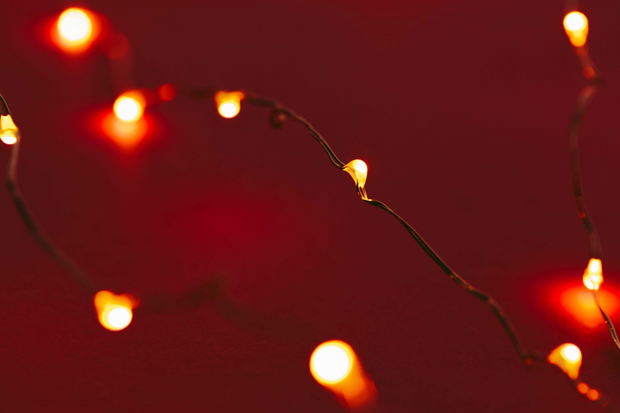 red-background-with-illuminated-lights-of-garland-2021-10-13-02-00-15-utc.jpg