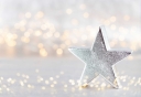 christmas-star-decor-on-bokeh-silver-background-2021-11-03-05-22-53-utc.jpg