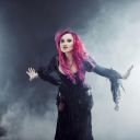 halloween-witch-creates-magic-attractive-woman-red-hair-witches-costume-standing-outstretched-arms-strong-wind-76648474.jpg