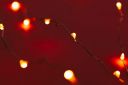 red-background-with-illuminated-lights-of-garland-2021-10-13-02-00-15-utc.jpg