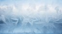 vecteezy_frost-patterns-on-a-window-depicting-ice-crystals-conveying_28652362_692.jpg