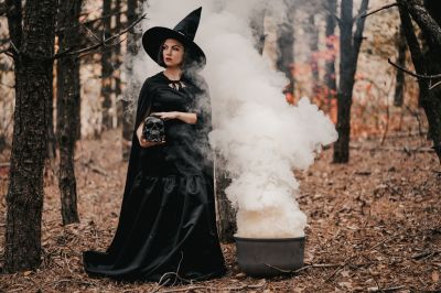 black-witch-holding-skull-in-hands-stroking-it-on-autumn-smoke-forest-background-horror-halloween_t20_gRZnvG~8.jpg