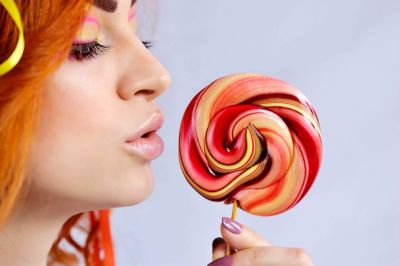 close-up-of-a-beautiful-girl-licking-a-colorful-lo-2021-08-27-17-25-53-utc~2.jpg