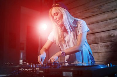 cute-dj-woman-having-fun-playing-music-at-cYL~3.jpg