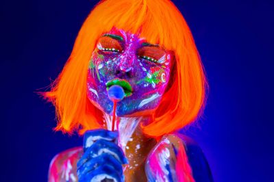 fashion-model-woman-licks-sweet-candy-in-neon-ligh-2022-02-18-05-24-49-utc~0.jpg