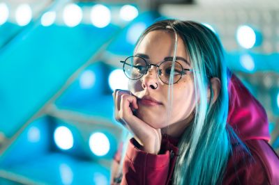 hipster-girl-with-blue-dyed-hair-and-sequins-as-freckles-woman-in-red-clothing-and-nose-piercing_t20_wQ7Vg0~8.jpg