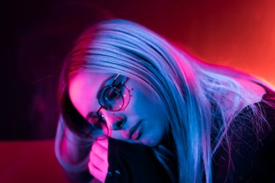 millennial-enigmatic-pretty-girl-with-unusual-dyed-hairstyle-near-glowing-neon-wall-at-night-blue_t20_OpQwgp~8.jpg