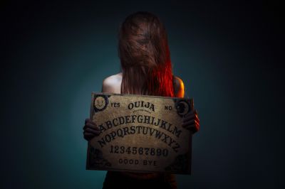 ouija-board-for-divination-girl-holding-a-ouija-b-2022-01-18-17-28-55-utc~2.JPG