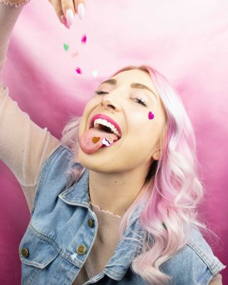 woman-wearing-blue-denim-vest-standing-while-eating-sweets-3520704~8.jpg