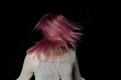 young-woman-swinging-her-pink-hair_t20_e3pY7b~8.jpg