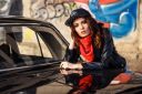 a-brunette-red-haired-girl-in-a-casual-style-black-leather-jacket-with-light-slinky-tights-jeans-in-a_t20_pLne81~0.jpg