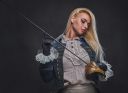 an-attractive-blonde-female-holds-a-silver-sword-FJ56QTQ~7.jpg