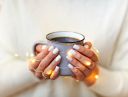 crop-woman-with-coffee-cup-in-glowing-garland-woman-cozy-mug-garland-warm-coffee-cup-winter-relax_t20_7yVAN6~8.jpg