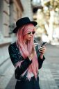 girl-with-pink-hair-with-a-smartphone-A2SZ6XR~3.jpg