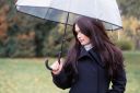 portrait-of-a-pensive-girl-with-long-black-hair-in-black-clothes-under-a-transparent-umbrella-female_t20_NGVG1Q~8.jpg