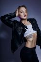 sexy-blonde-girl-with-tattoo-in-leather-jacket-and-2022-04-12-22-04-36-utc~0.jpg