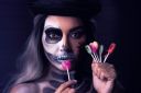 vecteezy_spooky-portrait-of-woman-in-halloween-gotic-makeup-holding_15859251_554~0.jpg