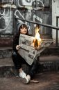 woman-holding-newspaper-while-burning-3422053~8.jpg