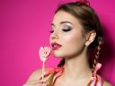 young-beautiful-woman-holds-heart-shaped-lollipop-2021-08-26-22-25-41-utc~2.jpg