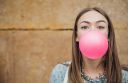 young-teenage-girl-blowing-pink-bubble-gum-ZDNR9XL~8.jpg